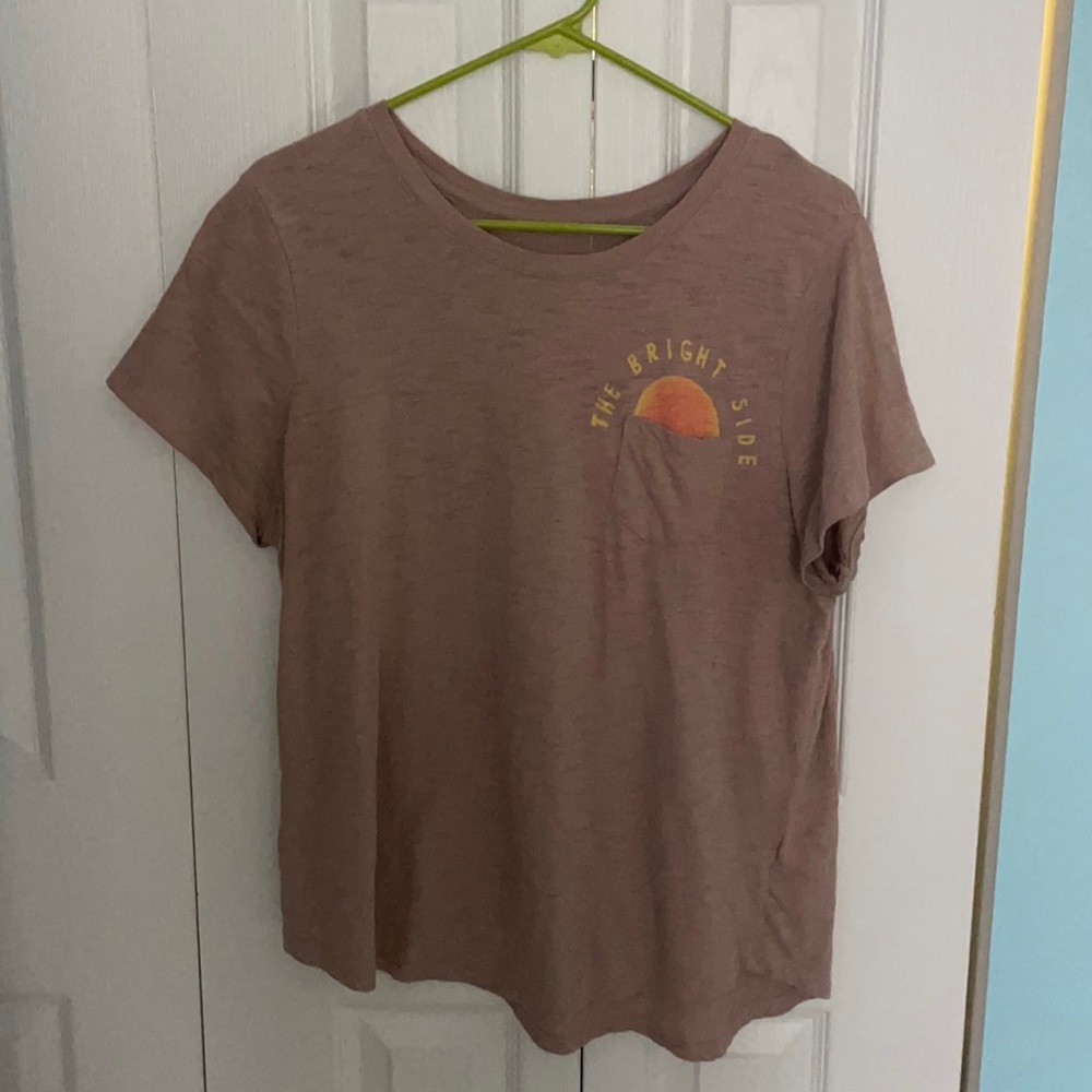 Light pink shirt.